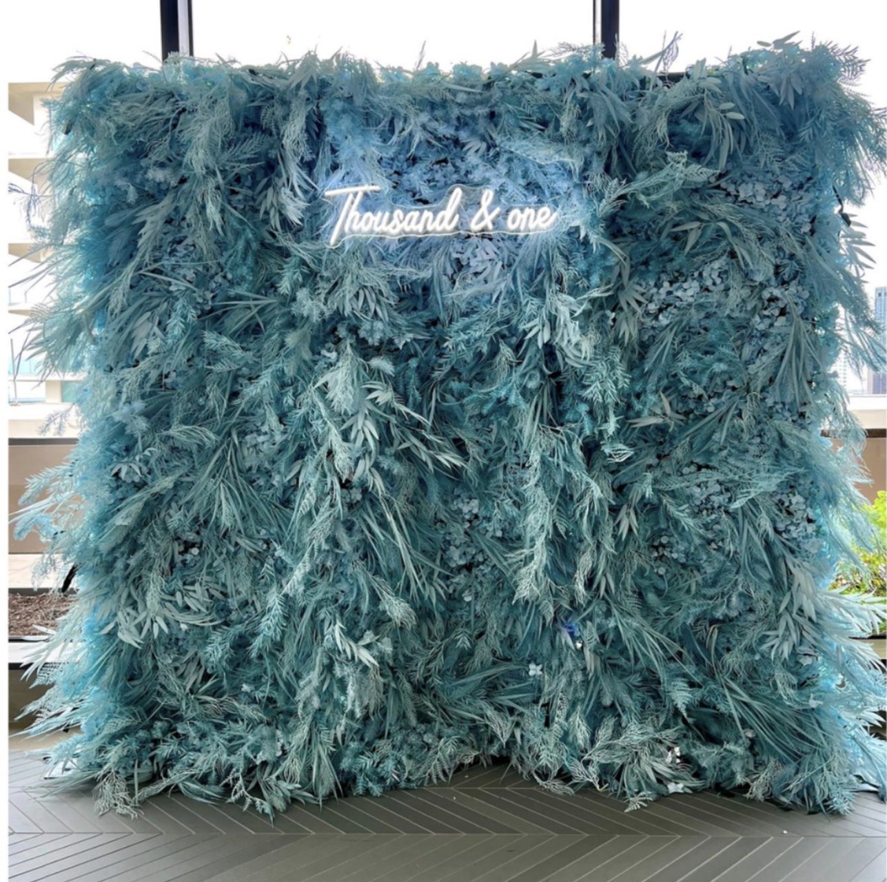 The Azul wall: blue plumes, with a neon sign